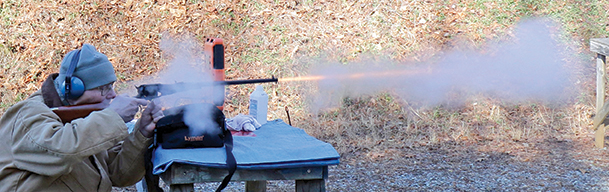 Notice the cloud of smoke around the rear of the revolving carbine and the smoke and flame issuing from the muzzle. Firing this weapon is like having a firecracker go off four inches in front of your nose.